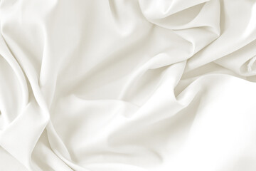 Cloud dancer toned silk fabric background with folds. Copy space. Monochrome background 2026 color.