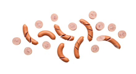 An overhead studio shot captures raw frankfurters,