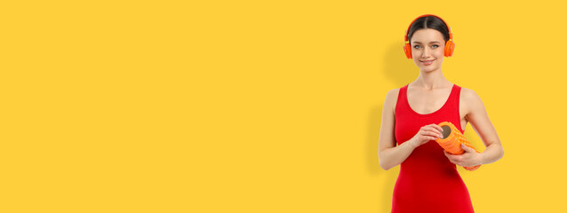 Yoga session with person smiling and holding yoga tools