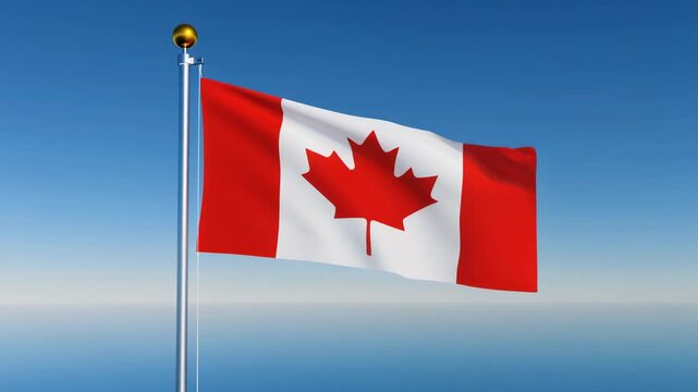 Vibrant Canadian flag waving against a clear blue sky and serene ocean backdrop