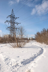 Paths through snowdrifts on the outskirts of the city
