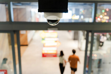 Surveillance CCTV Camera Monitoring Entrance Area in Modern Building for Security Control