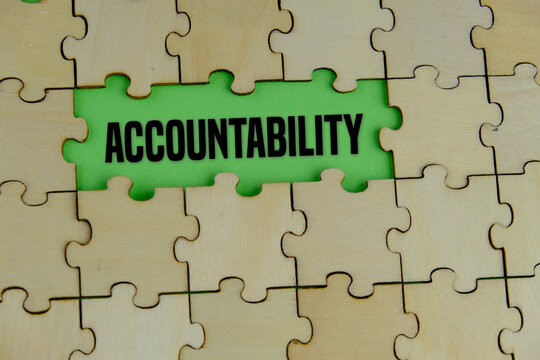 Wooden puzzle with the word ACCOUNTABILITY. concept of responsibility. responsibility for one's actions and decisions and being accountable for their outcomes