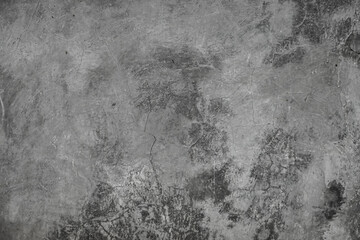 Grungy grey concrete wall with heavy vertical crack texture in black and white © Antler Tackle