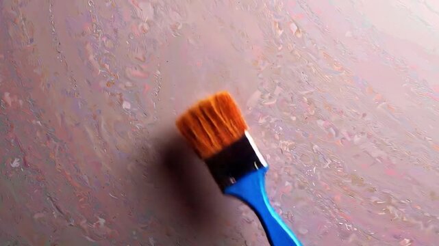 Paintbrush on textured surface artistic tool for design and creative projects