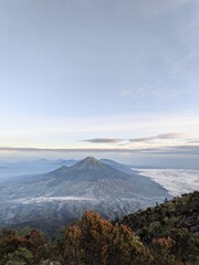 Fototapeta premium Man in Jacket Watching Mountain Sunrise
