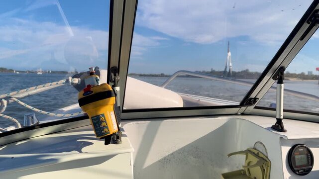 Boating Past Safety Beacon on Sunny Gold Coast Waterway