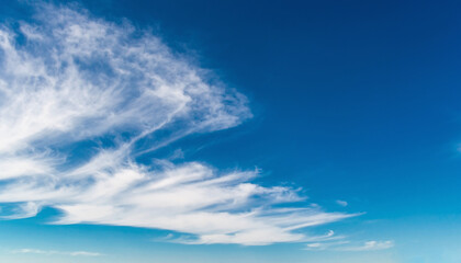 Vivid Blue Sky with Scattered White Cumulus Clouds on a Bright Sunny Day, Atmospheric Landscape Background Showing Clear Weather and Soft Cloud Formations