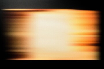 Warm blurred motion background with orange and gold streaks creating a glowing abstract effect ideal for energetic visuals, vibrant wallpapers, digital design projects