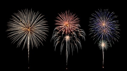 Brilliant golden red and blue fireworks explode against a deep black night sky creating a festive celebration atmosphere
