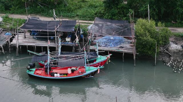 Close-up of colorful fishing boat docked on river
