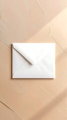 Minimal white envelope on textured peach background with soft shadows creating a clean, simple, aesthetic composition