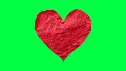 Crumpled red heart paper