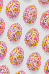 Sparkling easter eggs as minimal trend pattern. Contemporary design, abstract aesthetics celebration food. Pink eggs with bright texture of rhinestones or sequins as easter spring holiday background.