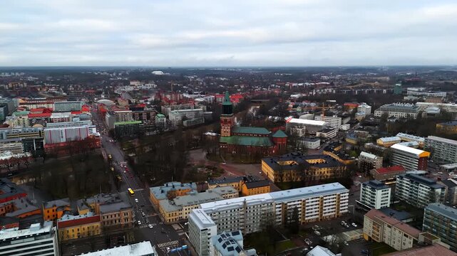 Aerial view orbiting the Turku Cathedral, snowless winter day in Proper Finland