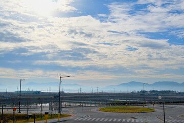 A road with a roundabout on a clear day