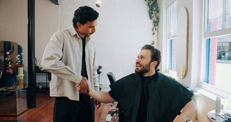 Hairdresser, handshake and man with customer in barber for grooming, haircut and trim for beard...