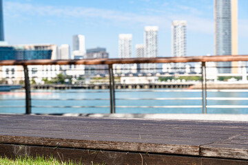 Scene of Wooden Bench with City Skyline

