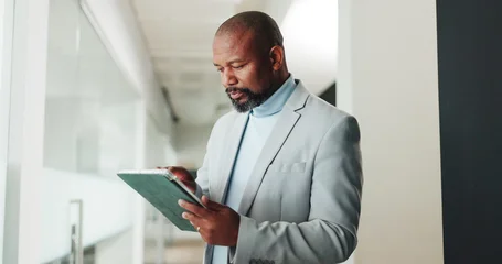 Fotobehang Muziek Tablet, professional and businessman in office with research for finance report for budget plan. Digital technology, reading and African male financial manager with email for investment proposal.  © peopleimages.com