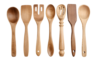 Collection of rustic wooden kitchen utensils on a black background