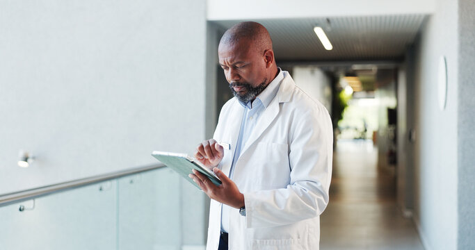 Tablet, confused doctor and black man in hospital for healthcare error, glitch or reading report. Tech, medical professional or serious mature person with mistake for telehealth, records or insurance