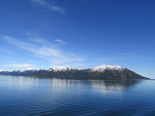View from cruise ship of Snow Capped Mountains in College Fjord, Alaska.