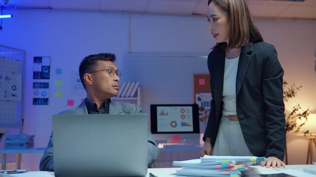 Female boss blaming a stressed male employee for a work mistake. The businessman feels burnout and pressure from overworking on a project deadline
