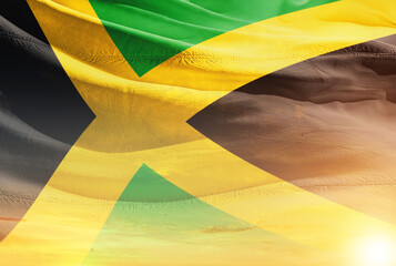 Jamaica national flag waving in sunny sky with beautiful sunset. Jamaica national flag for...