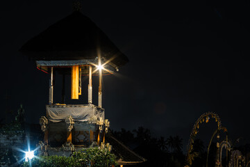 Traditional Balinese Kulkul Tower at Night in Penglipuran Village