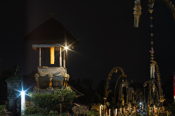 Traditional Balinese Kulkul Tower at Night in Penglipuran Village