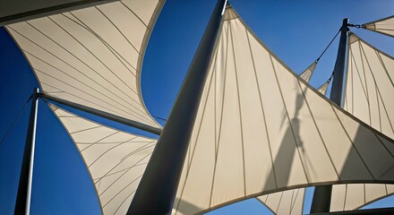Modern Architectural Sail Shade Structures Against Blue Sky Outdoor Design