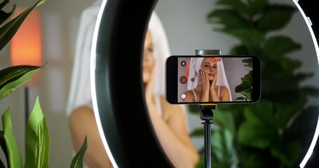 Influencer Applying Skincare in Tropical Home Setting