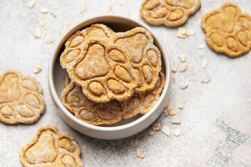 Homemade dog treats in bowl with paw prints