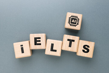 Obraz premium Wooden blocks arranged to spell IELTS with an additional AI icon block, symbolizing English test preparation supported by artificial intelligence, modern educational technology