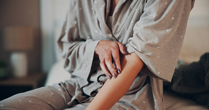 Scratching, skin and stress in bedroom, hands and coping mechanism for anxiety, discomfort and home. Itchy, arm and person with OCD symptoms, psychology and mental health condition or trauma in house