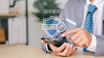 Close-up of a man using smartphone with virtual password input and login button. Concept of secure mobile authentication, user access control, and cybersecurity protection.