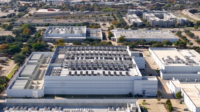 Aerial view of large modern AI or IT data centers in Richardson, Texas. New industrial growth in USA.