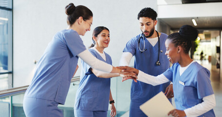 Smile, people and doctors with handstack in hospital for celebration, surgery success and victory. Happy, healthcare workers and huddle for medical milestone, staff motivation and team achievement