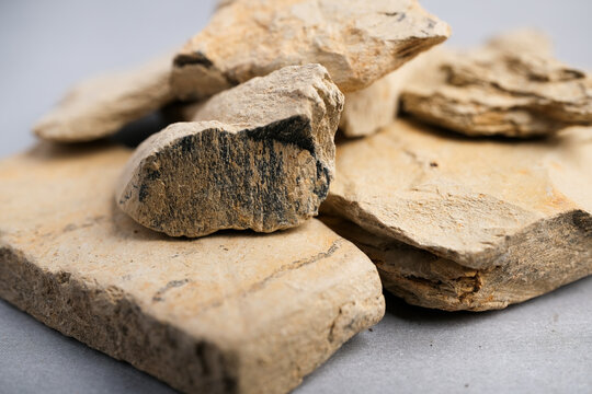 Macro Still Life of Layered Pieces of Natural Mineral Clay (Kaolinite/Montmorillonite) Used in Traditional Cosmetic and Skincare Applications.