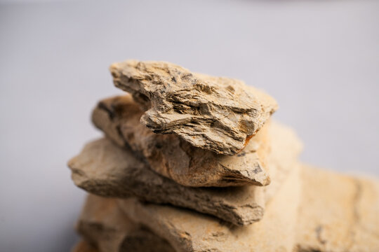 Macro Still Life of Layered Pieces of Natural Mineral Clay (Kaolinite/Montmorillonite) Used in Traditional Cosmetic and Skincare Applications.
