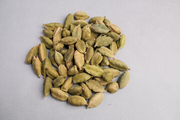 Macro Close-up of Whole Dried Green Cardamom Pods (Elettaria cardamomum) Used Globally as a Highly Aromatic