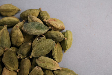 Macro Close-up of Whole Dried Green Cardamom Pods (Elettaria cardamomum) Used Globally as a Highly Aromatic