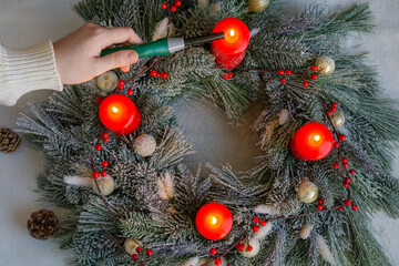 Lighting an Advent Wreath with Four Red Candles