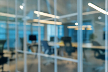 Bright blurred office background with glass walls and desks in modern