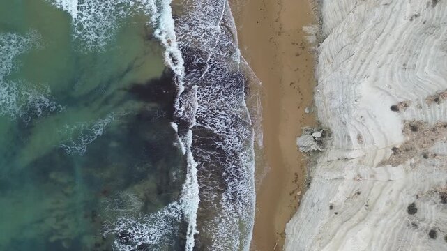 sea water flowing scala dei turchi Beautiful white beach from above drone shot pretty blue ocean sea