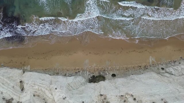 sea water flowing scala dei turchi Beautiful white beach from above drone shot pretty blue ocean sea