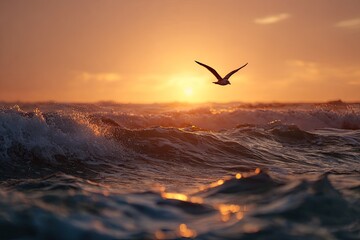 A bird soars above ocean waves as the sun dips towards the horizon, casting a warm glow