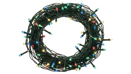 A circular coil of blackwired colorful Christmas lights arranged on a white surface