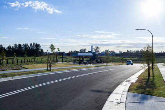 New road in housing suburb under development with park already completed