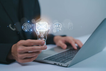 The image depicts email, inbox, messages, and online communication through digital devices.	 